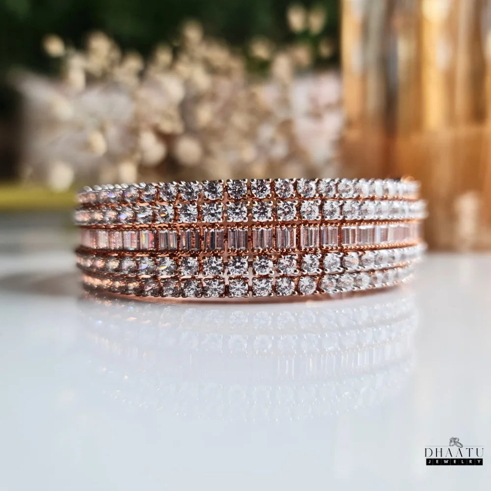 Front view of the Dhaatu Jewelry rose gold plated American Diamond Kada bracelet, emphasizing the pattern of baguette and round AD stones