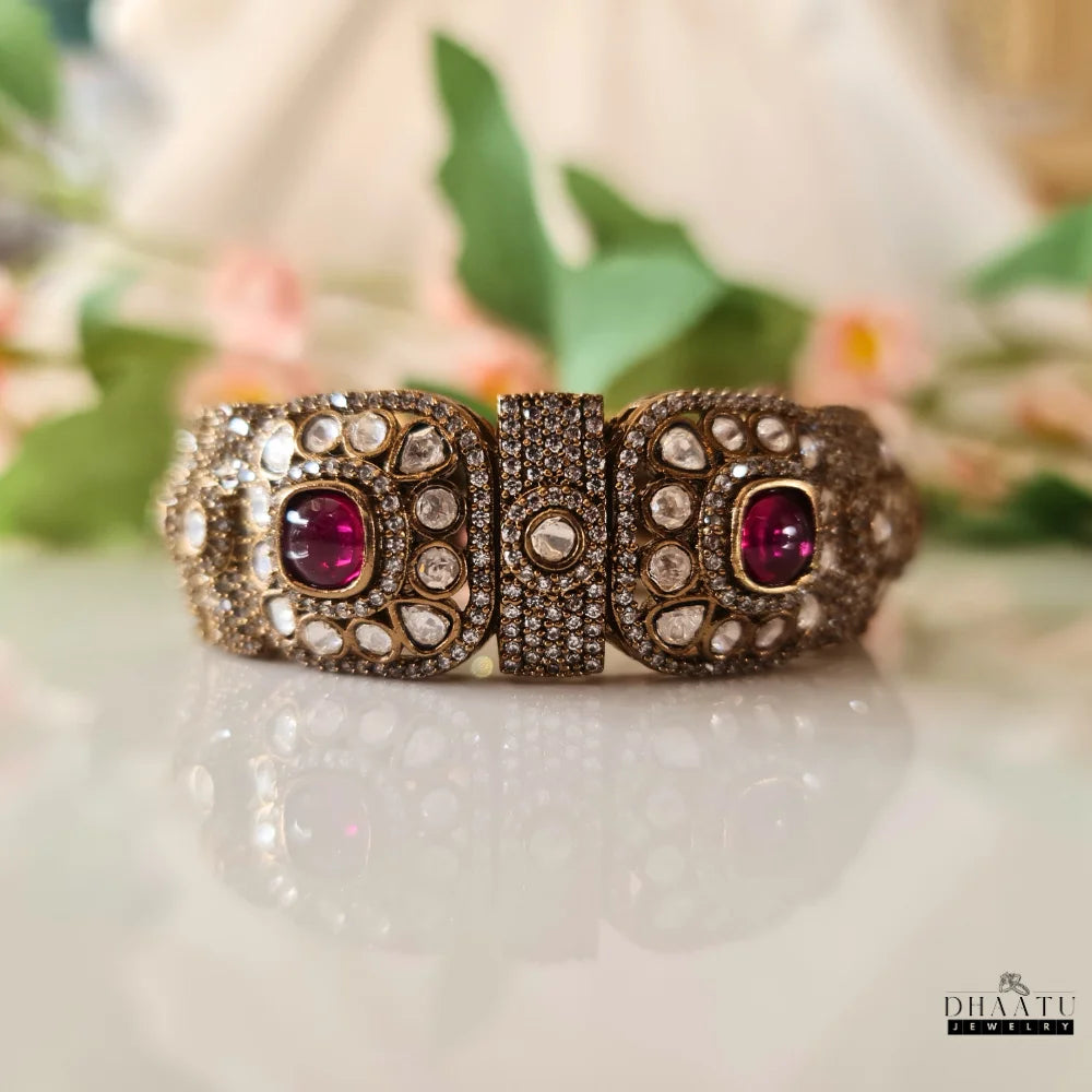 Dhaatu Jewelry Polki and Ruby Kada Bracelet in a closed position, showcasing the seamless design when worn.