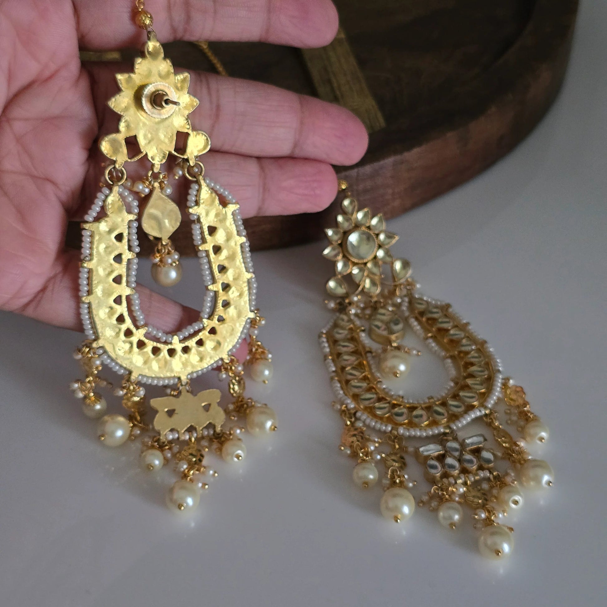 Back view of a single gold-plated Chandbali earring, showcasing the intricate filigree work and secure stud.
