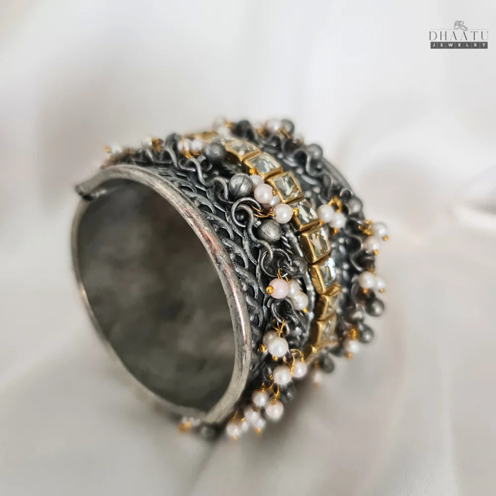 Video demonstrating the beauty and adjustability of the Kundan and pearl oxidized silver cuff bracelet