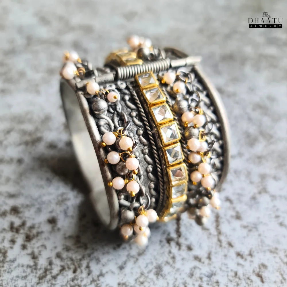 View of the adjustable opening on an ethnic oxidized silver cuff bangle