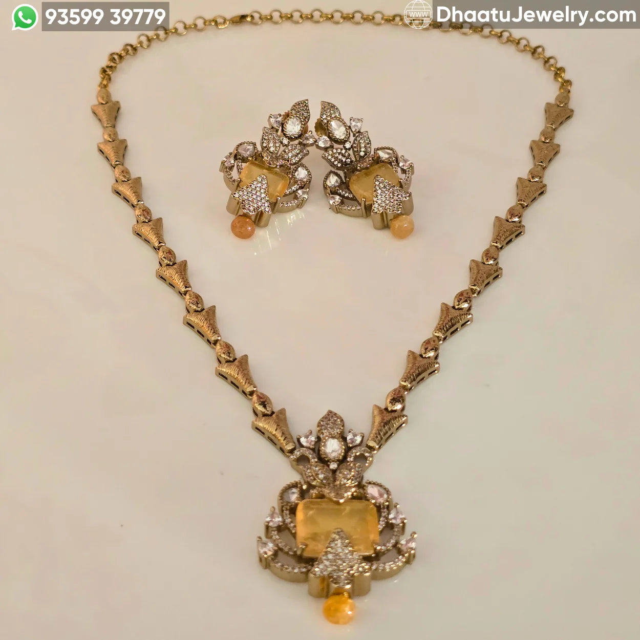 Handcrafted Floral Motif Necklace Set with Rectangular Baguette Stones and Contrast Drops