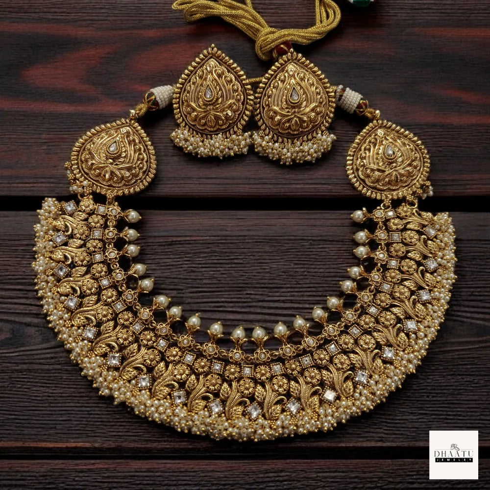 Antique Gold-Plated Nakshi Choker Necklace Set with White Stones and Pearl Clusters