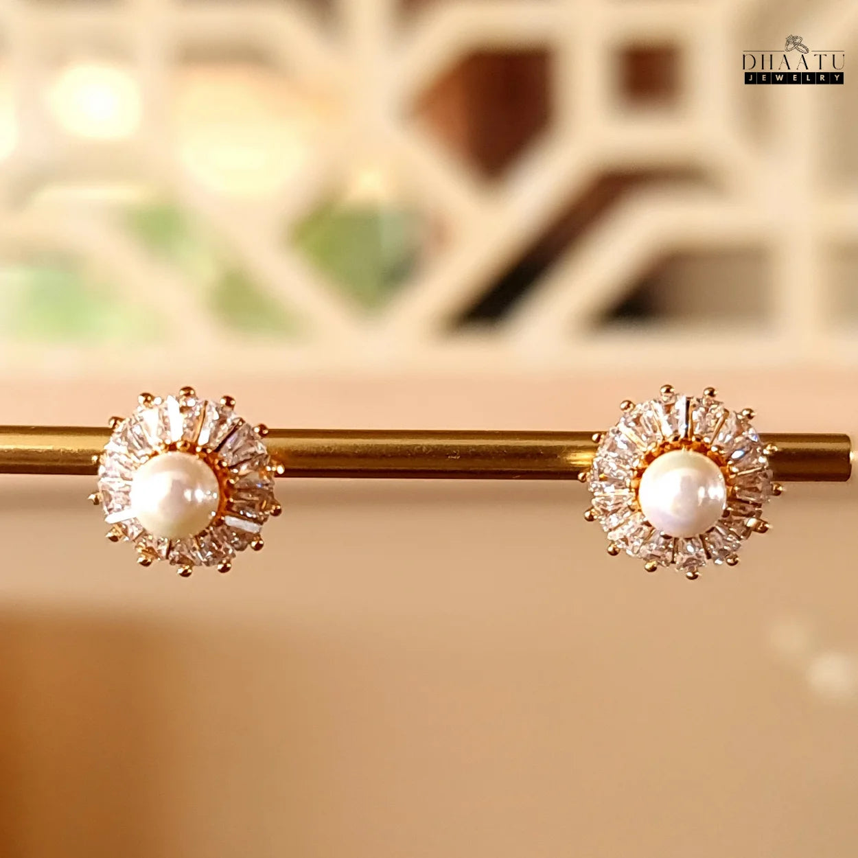 Close-up front view of DHAATU JEWELRY Pearl and Cubic Zirconia Sunburst Stud Earrings with gold plating, showcasing intricate design and sparkle
