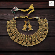 Antique Gold-Plated Jhumka Choker Necklace Set with Emerald Green Accents and Pearl Droplets