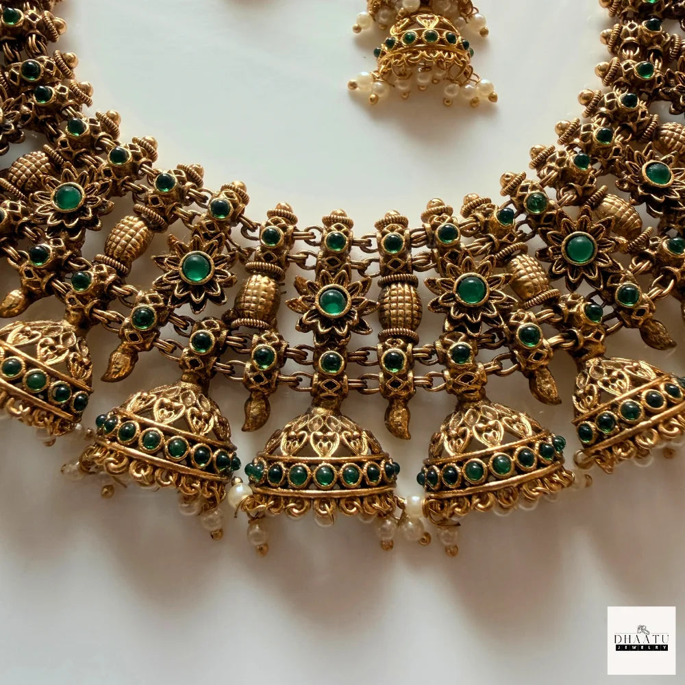 Antique Gold-Plated Jhumka Choker Necklace Set with Emerald Green Accents and Pearl Droplets