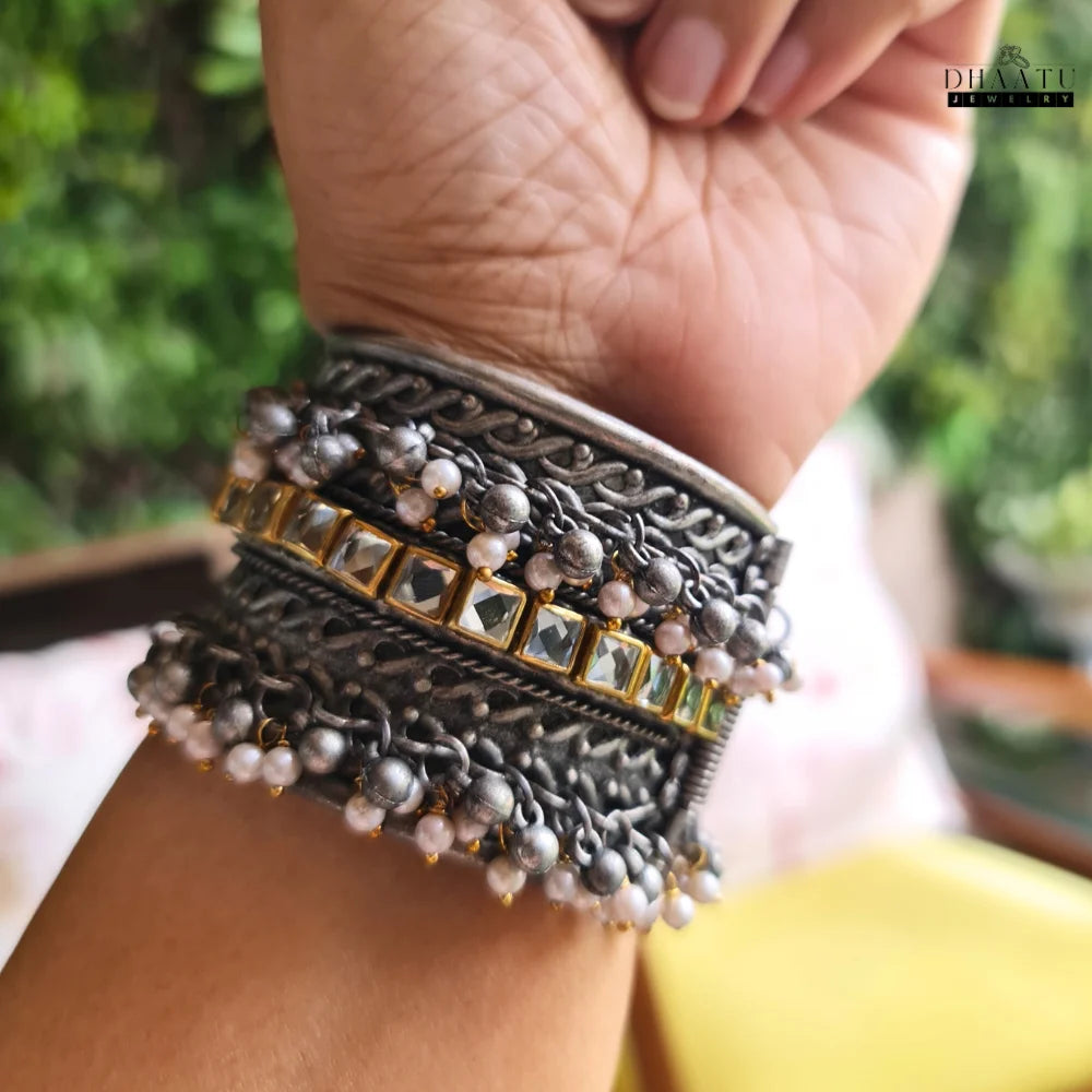 Kundan and pearl ethnic cuff bracelet styled on a wrist, showcasing its wear