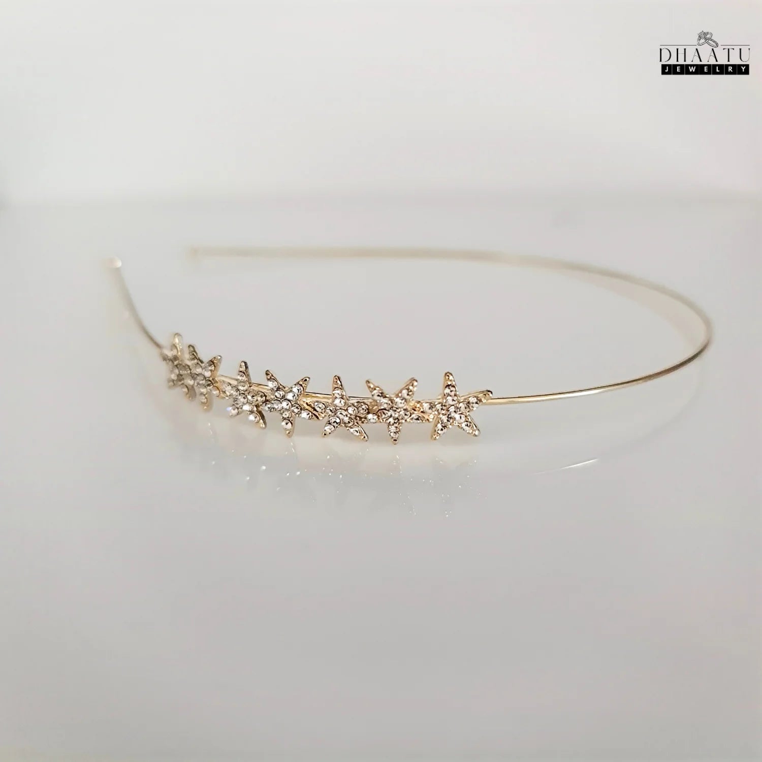 Full view of modern Western hairband with cubic zirconia stars on a light background, highlighting its contemporary style.