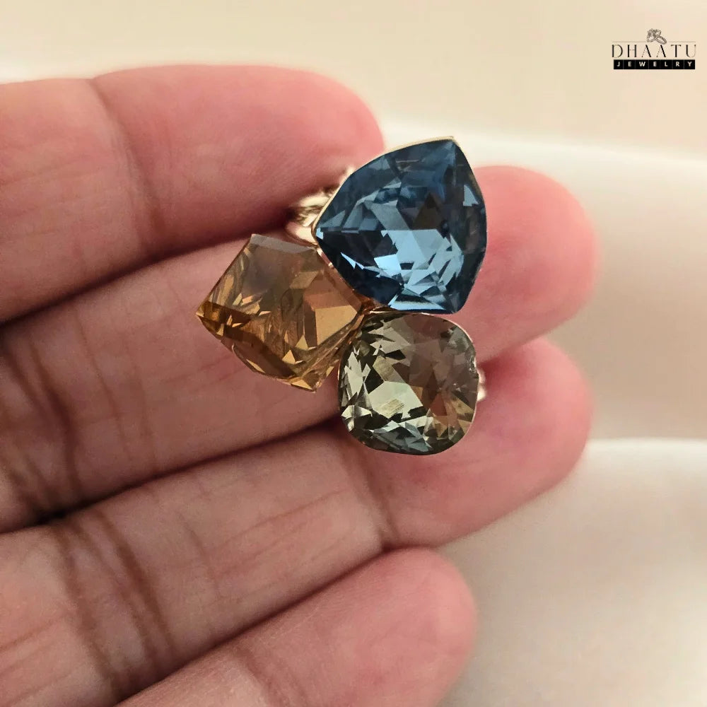 Hand model wearing the multi-colored gemstone cocktail ring, showing how it looks on a hand.