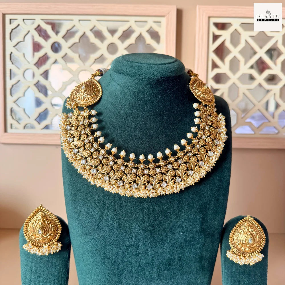 Antique Gold-Plated Nakshi Choker Necklace Set with White Stones and Pearl Clusters