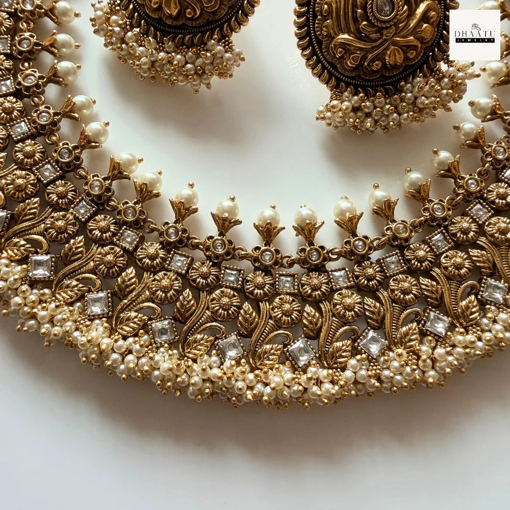 Antique Gold-Plated Nakshi Choker Necklace Set with White Stones and Pearl Clusters