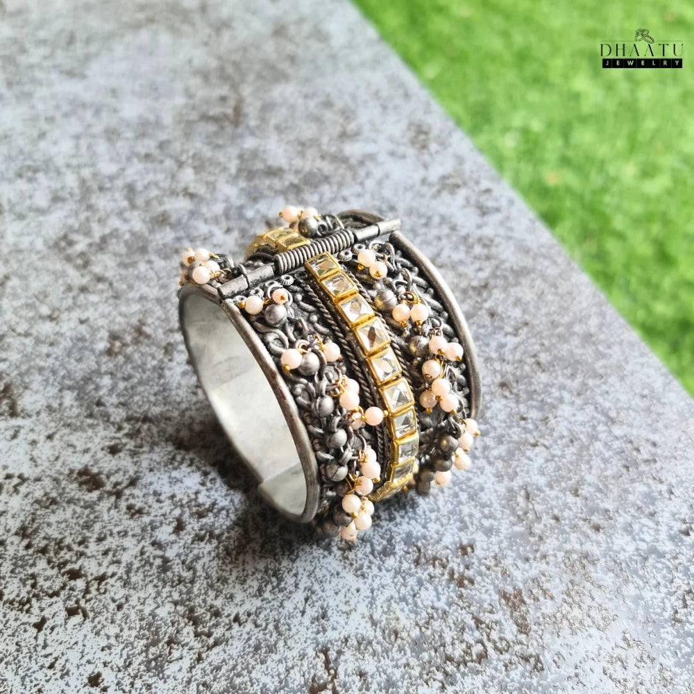 Rear view of the pearl and Kundan embellished oxidized silver cuff bracelet