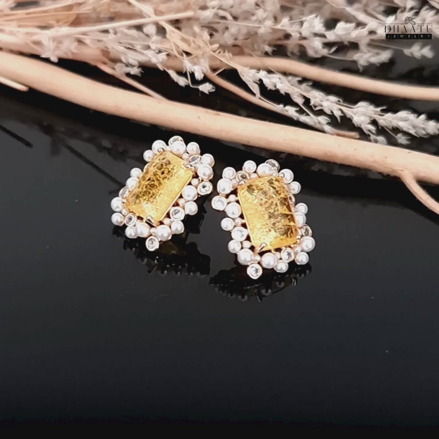 Load video: A video showcasing the DHAATU JEWELRY citrine, polki, and pearl stud earrings, highlighting their sparkle and design details.