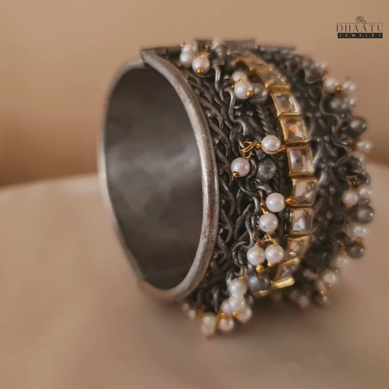 Video demonstrating the beauty and adjustability of the Kundan and pearl oxidized silver cuff bracelet