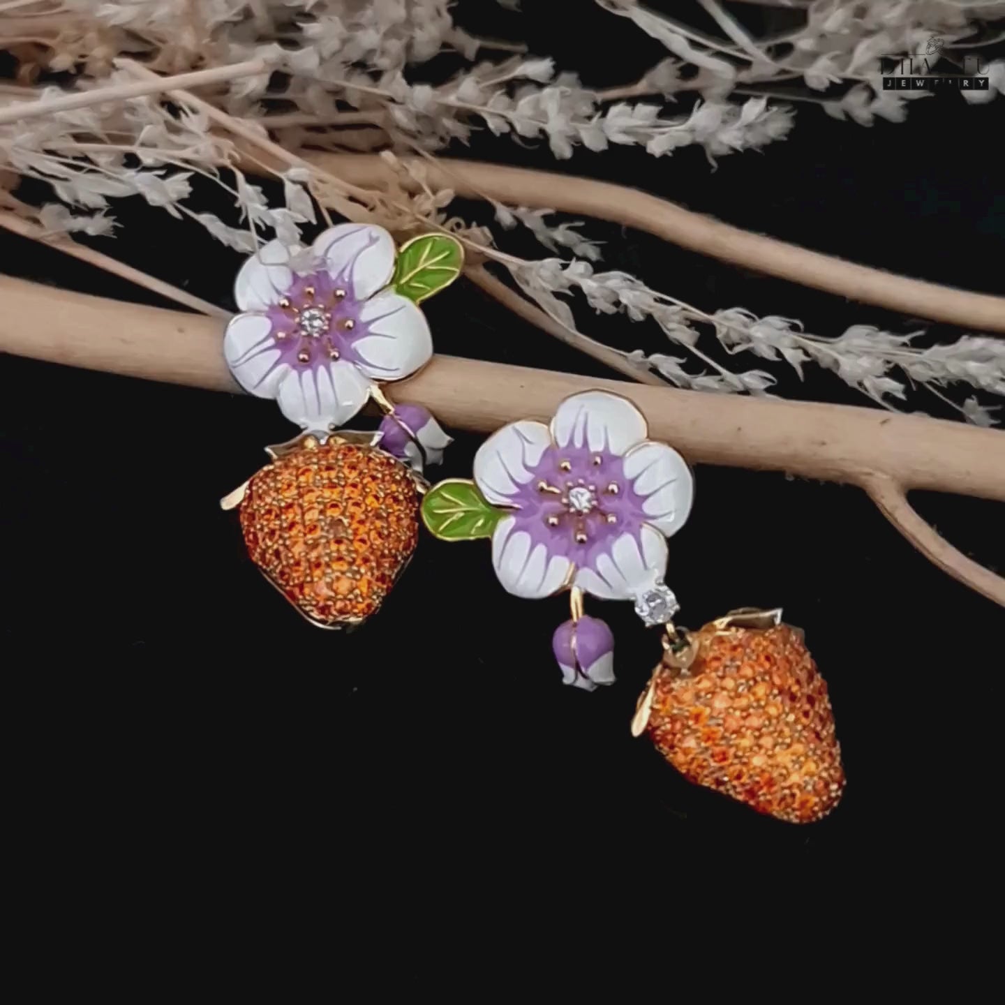 Load video: Product video of gold plated orange cz and enamel flower strawberry earrings.