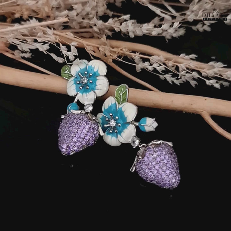 Product video of silver plated violet cz and enamel flower strawberry earrings.