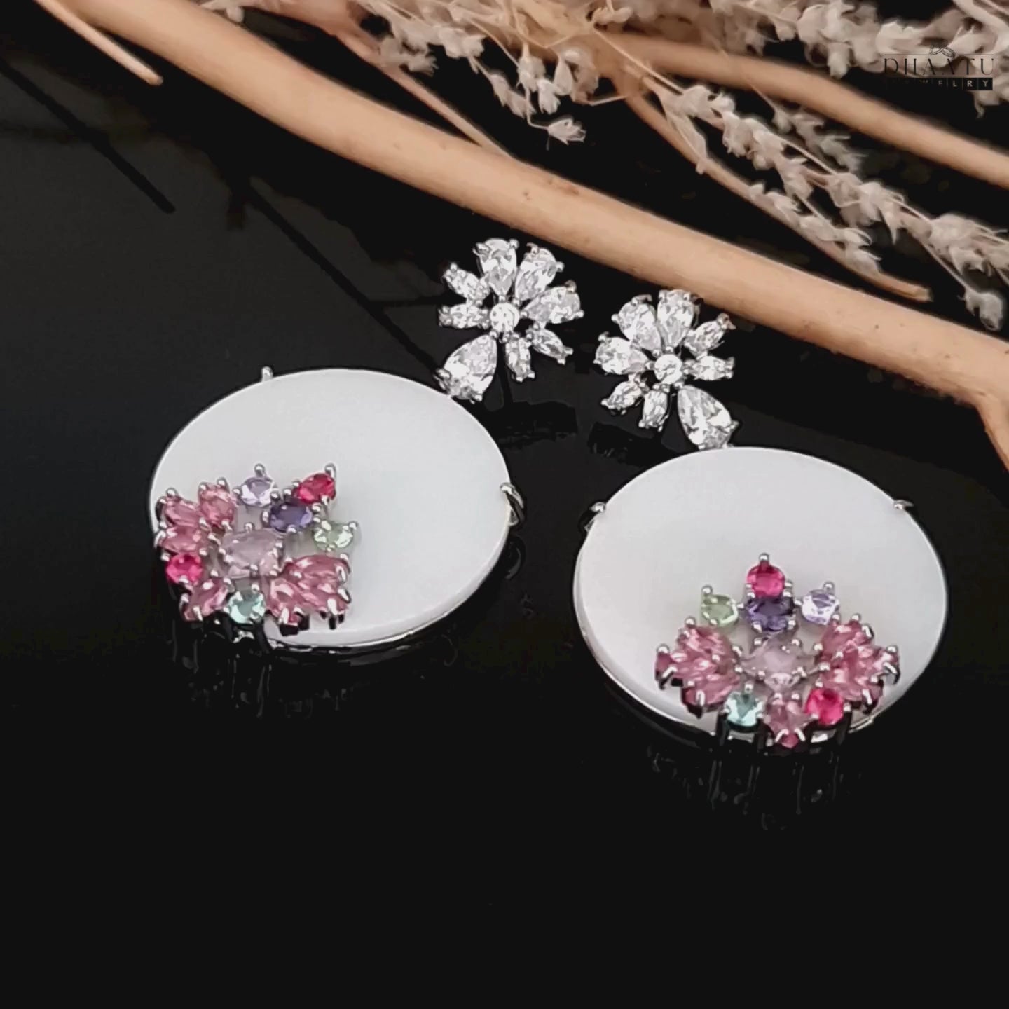Load video: Video showcase of Dhaatu Jewelry floral stud dangle earrings with multi-colored gems and sparkling cubic zirconia.