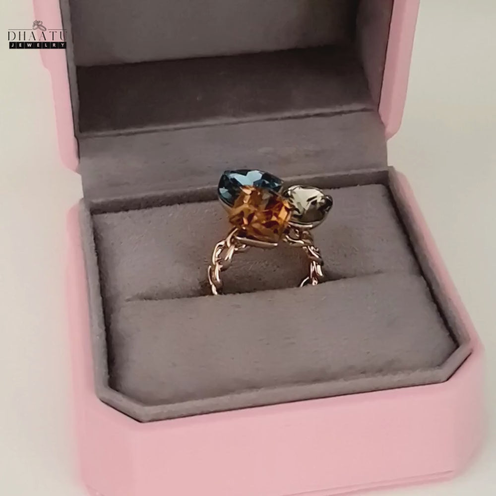 Load video: Video of the elegant cocktail ring being presented in an open pink jewelry box.