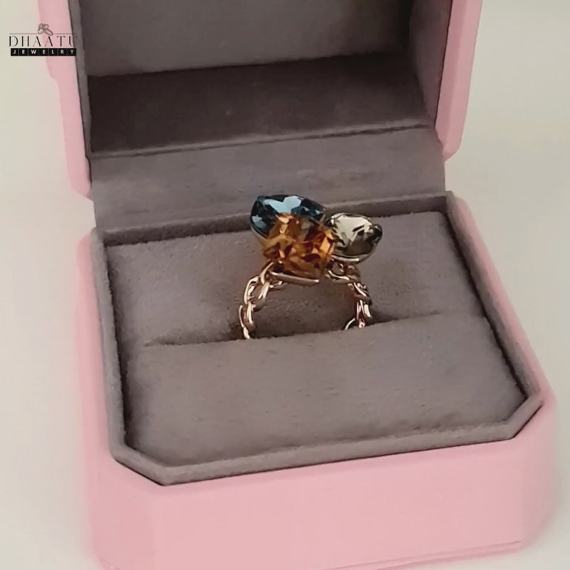 Video of the elegant cocktail ring being presented in an open pink jewelry box.