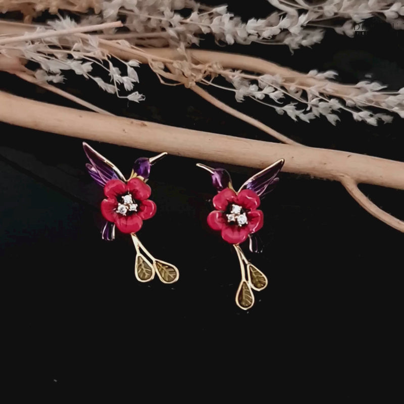 A video showcasing the red and purple enamel hummingbird earrings, highlighting their design and movement.