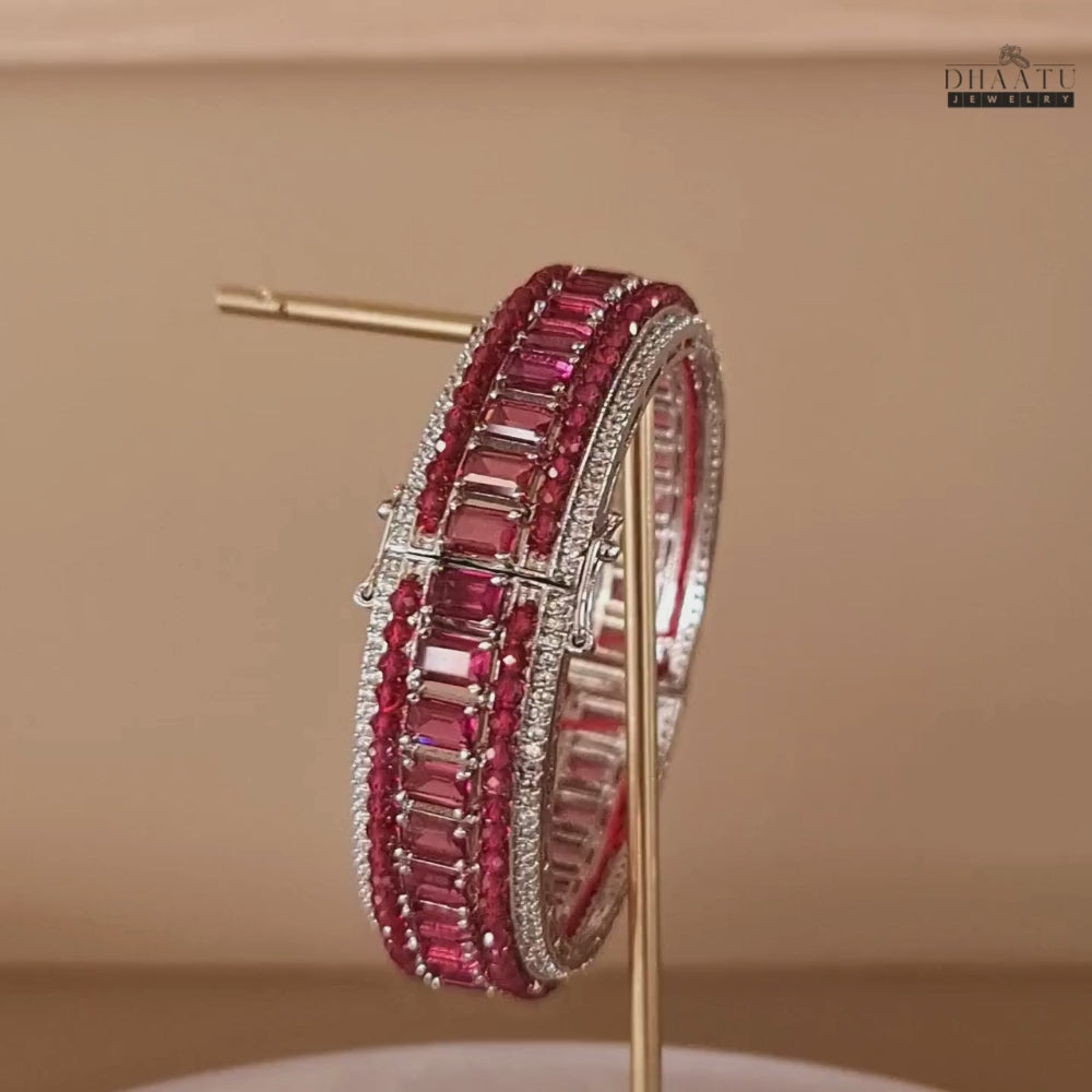Load video: Video showcasing a 360-degree view of the Dhaatu Jewelry pink ruby and diamond simulant bangle bracelet.

