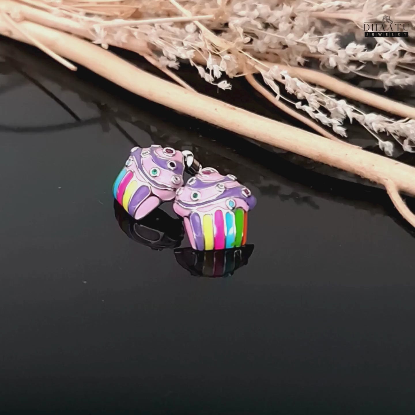 Load video: A short video showcasing the colorful cupcake enamel stud earrings, turning to show all sides and the intricate details, with a natural background.