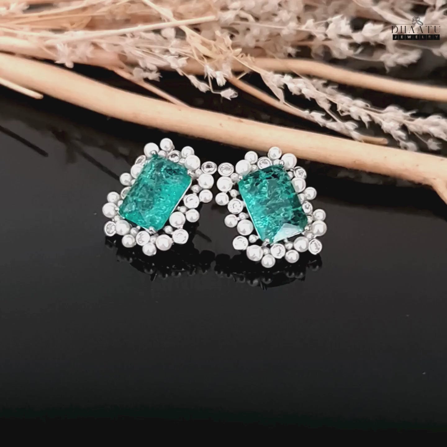Load video: A video showcasing the DHAATU JEWELRY green, polki, and pearl stud earrings, highlighting their sparkle and design details.