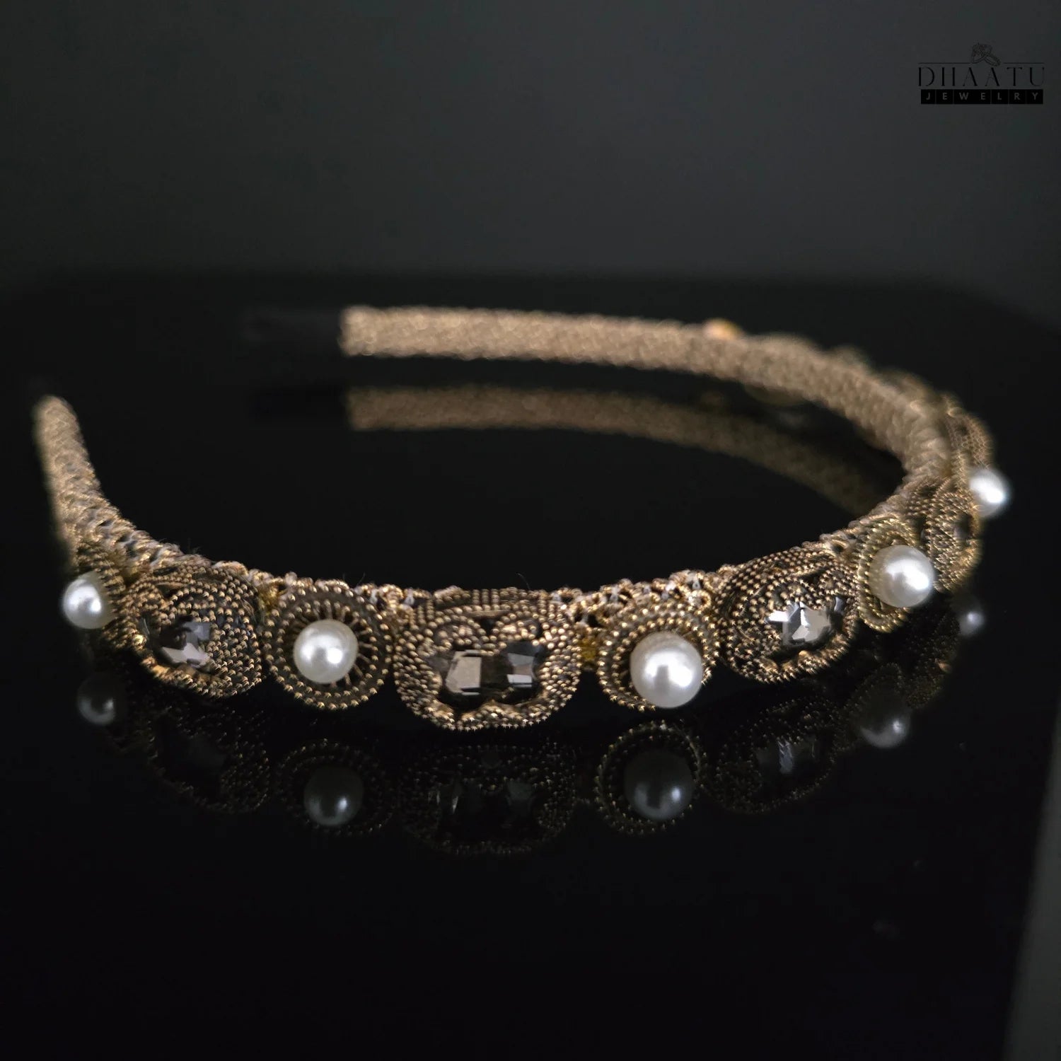 Sophisticated gold-toned hair accessory with shimmering pearls and crystals, highlighting the detailed craftsmanship